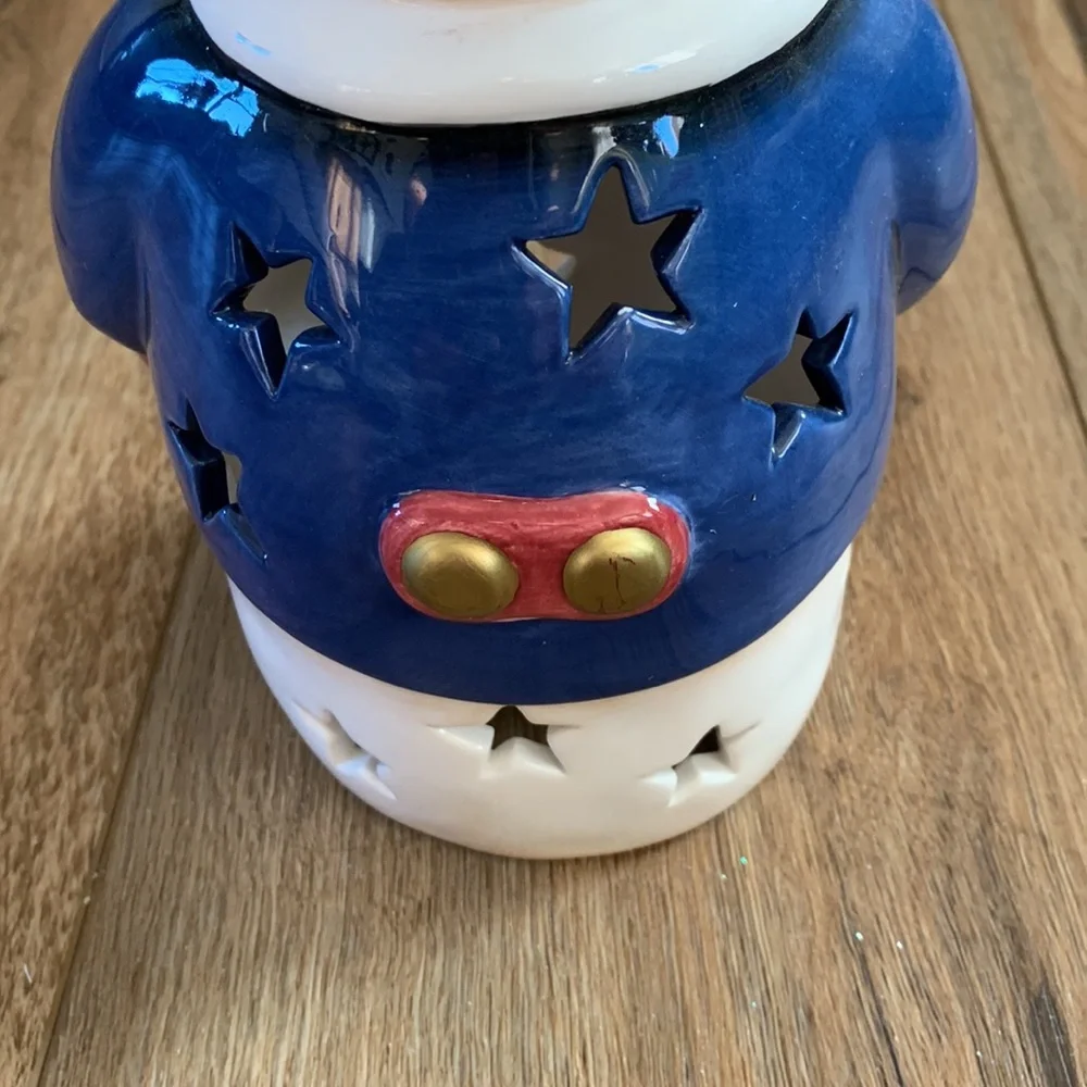 Snowman decor used as Christmas tree topper but think you can put light inside